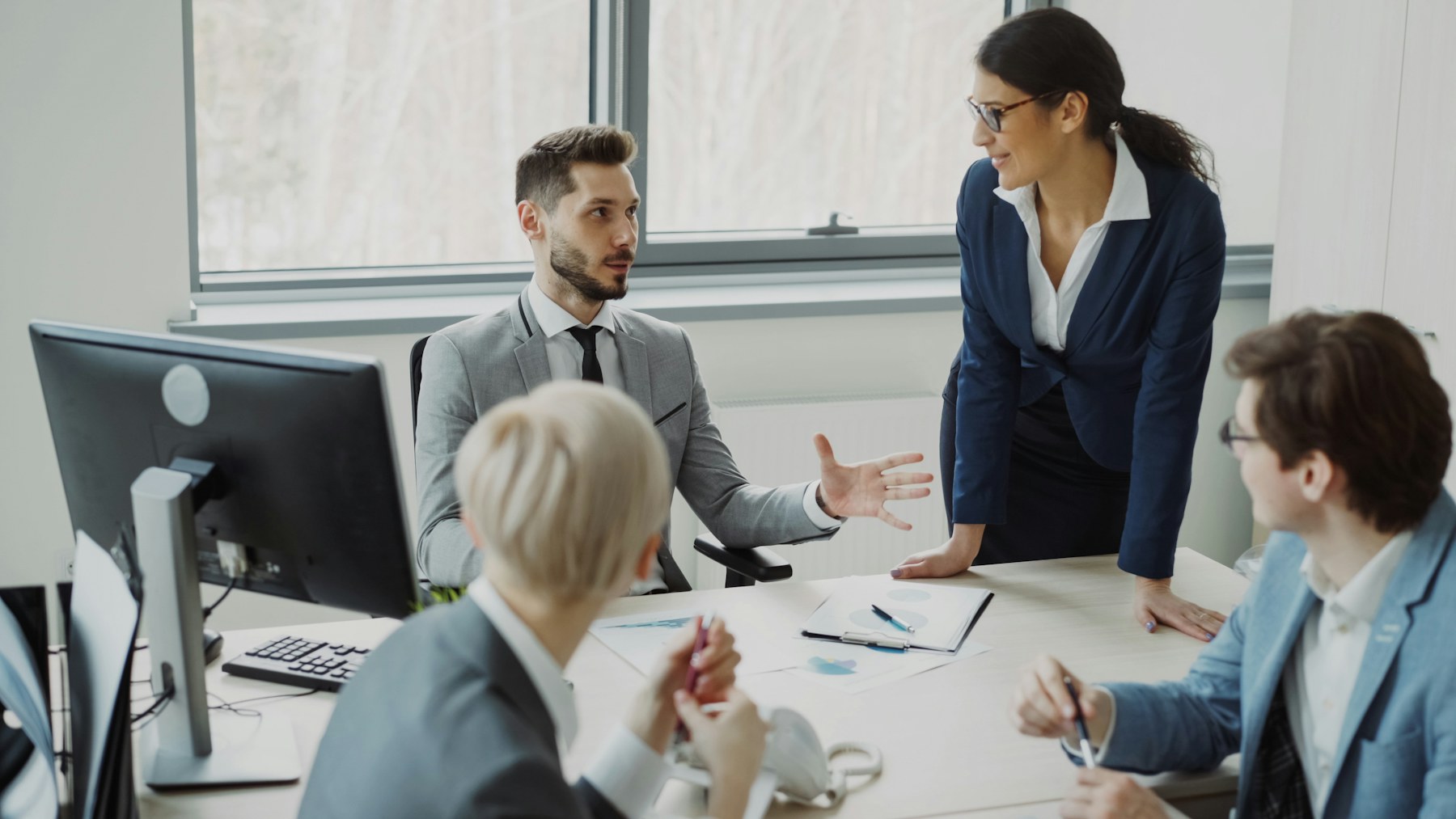 Four business leaders working together around a table
